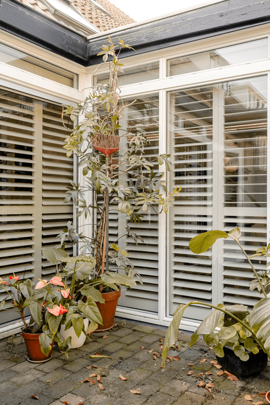 shutters groen woonkamer tuin